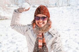 Woman throwing snowball